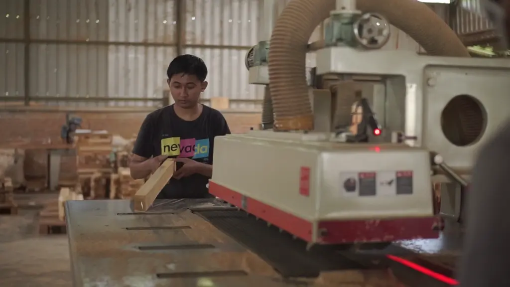 applying teak oil on outdoor furniture to maintain golden color