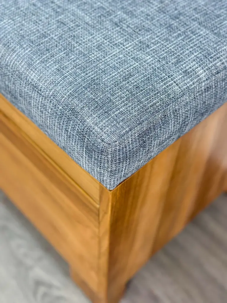 Close-up of premium Grade A teak wood with golden brown color and straight grain pattern